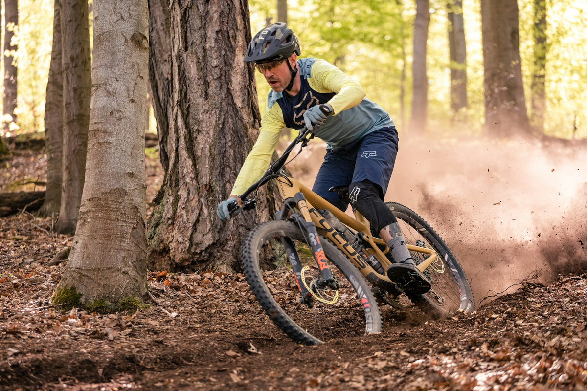 Mountain biker riding a forest trail